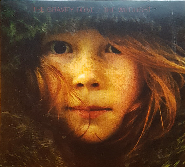 CD cover: close-up portrait of a child with long hair.