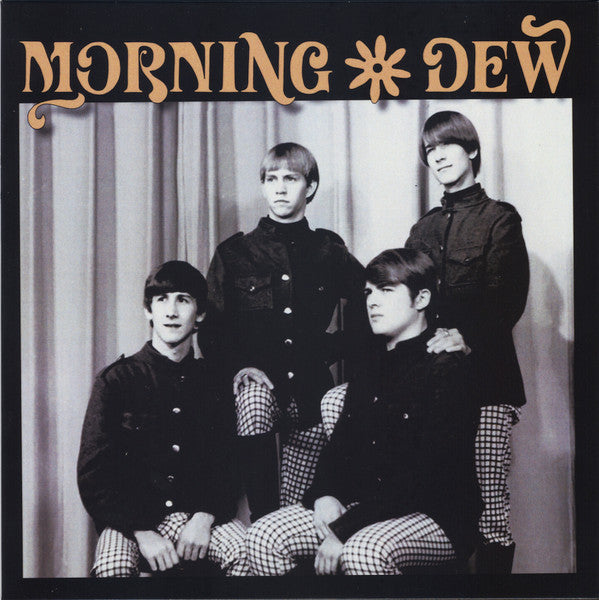 Black and white album cover featuring four young men in patterned clothing.