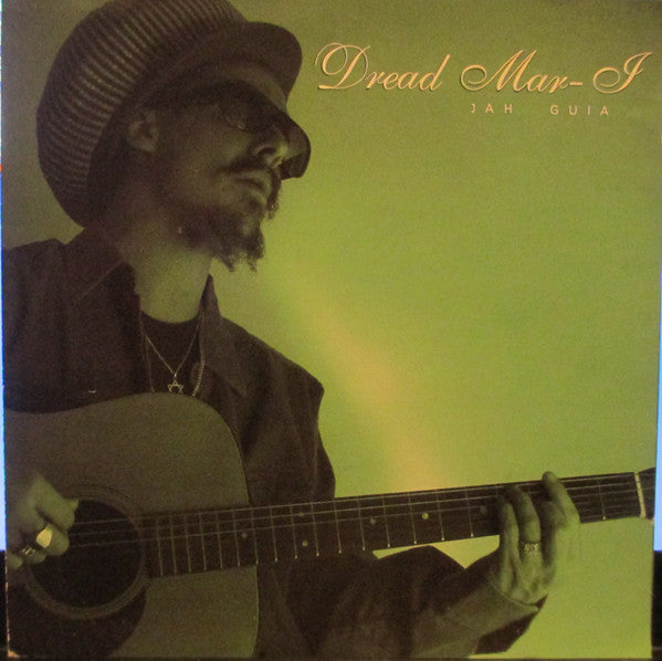 CD cover featuring a man with dreadlocks playing an acoustic guitar.