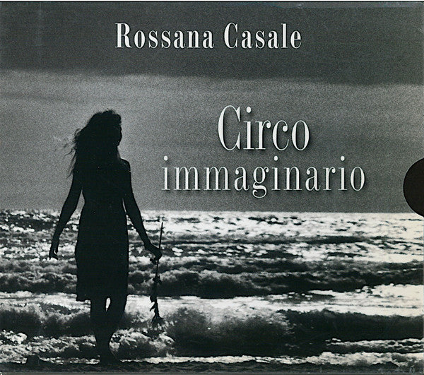DVD cover: Silhouette of a woman on a beach, text "Circo immaginario".