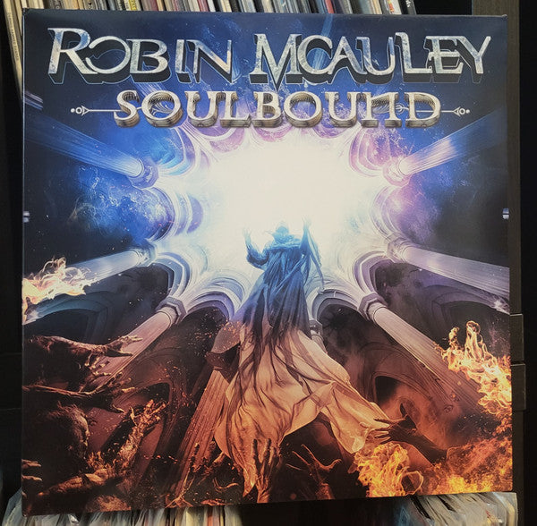 Album cover for Robin McAuley’s “Soulbound” with fantasy art and blue hues.