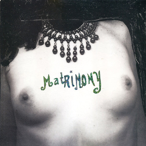 Record album cover featuring a torso with the word "Matrimony" written on it.