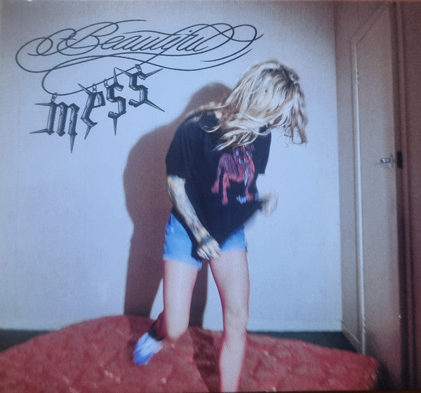 CD cover: woman with blonde hair bending over in denim shorts.