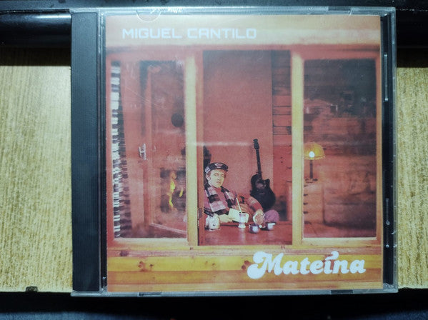 CD case for Miguel Cantilo’s “Mateina” album, featuring a window scene.