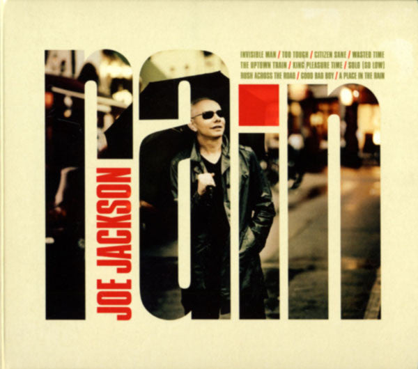 DVD cover for “Rain” featuring Joe Jackson in a black and white portrait.