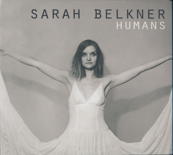 Black and white album cover of Sarah Belkner in a white dress, arms outstretched.