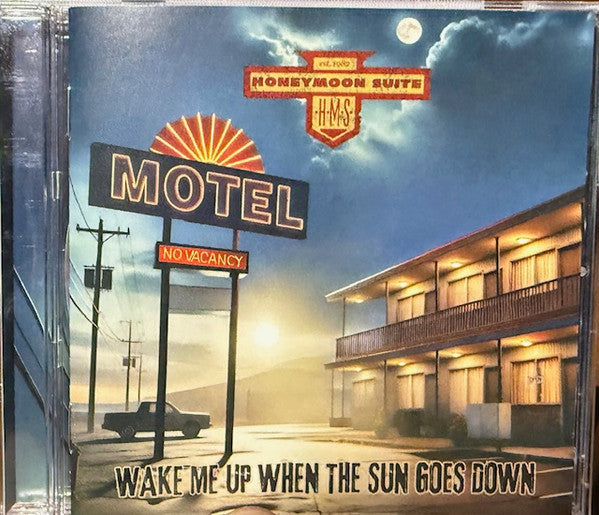 CD cover: motel sign under a night sky, building on the right.