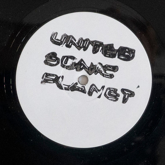 White vinyl record label with black handwritten text: "United Sounds Planet".