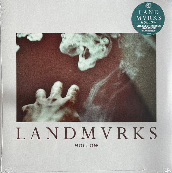 Vinyl record cover for Landmvrks’ “Hollow” with abstract cloud imagery.