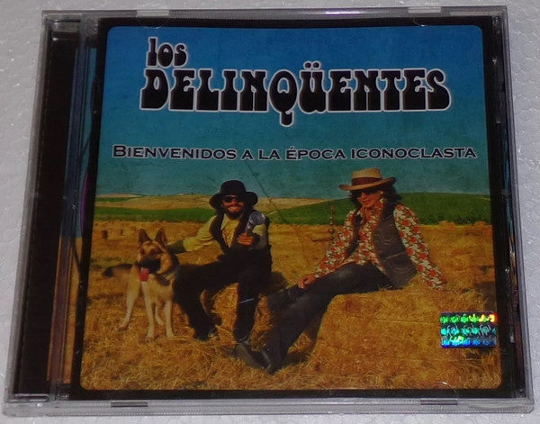 CDL album cover featuring two men in hats and a dog in a field.