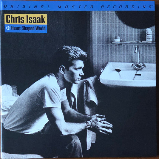 Chris Isaak album cover, black and white photo of a man shaving.