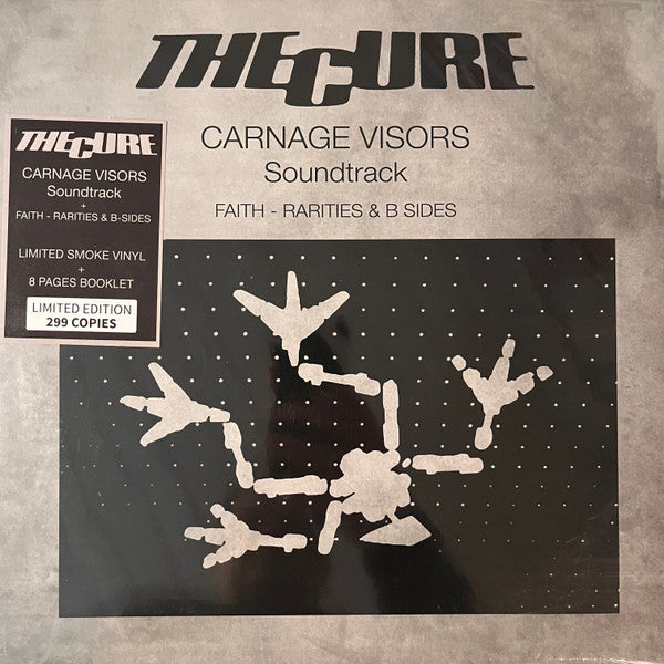 The Cure “Carnage Visors” vinyl record with stark white figures.