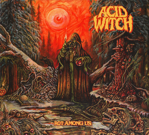 A hooded witch stands in a red-tinted forest filled with skeletons and decay.