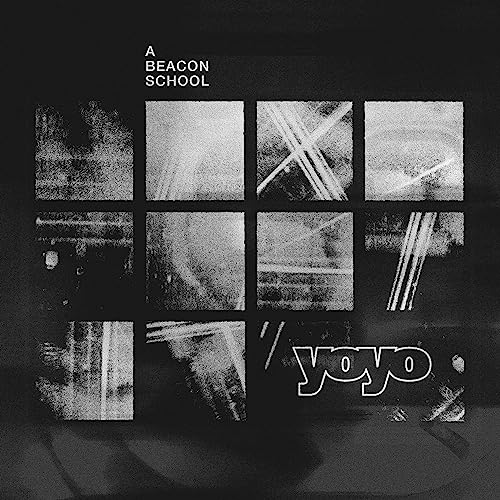 Black and white album cover with a grid of abstract textured squares and text.