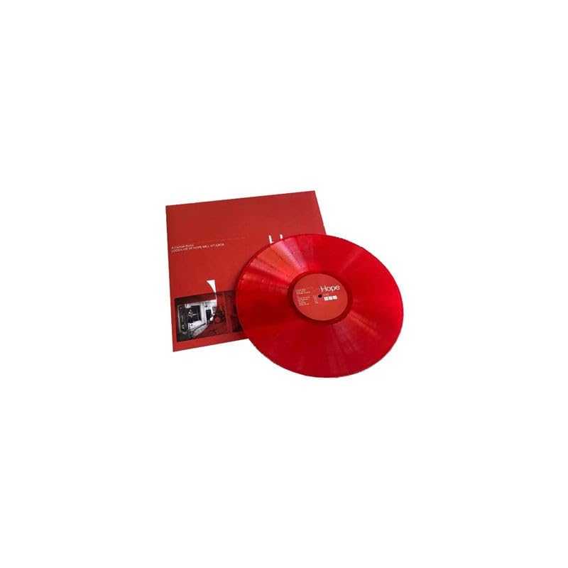 Red vinyl record and sleeve with a building image.