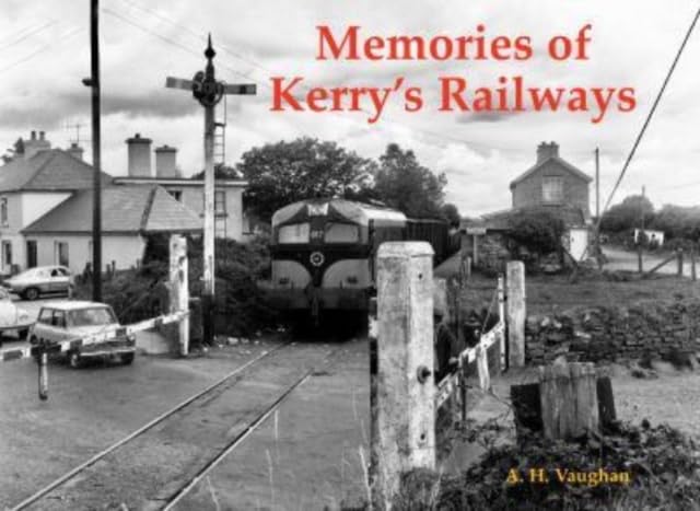 Black and white photo of a diesel train at a rural Irish railway crossing.