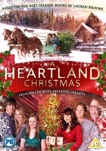 DVD cover for "A Heartland Christmas" featuring a snowy ranch scene and cast.