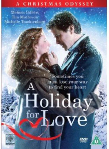 A man and woman embrace in a snowy landscape on the A Holiday for Love DVD.