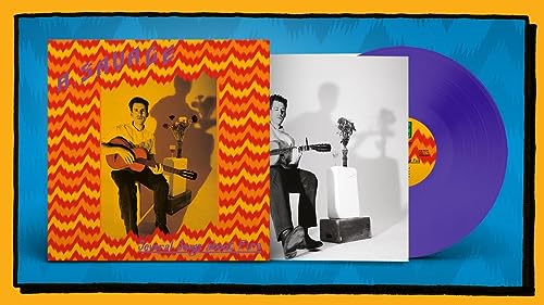A. Savage album cover, inner sleeve, and purple vinyl record on a blue background.