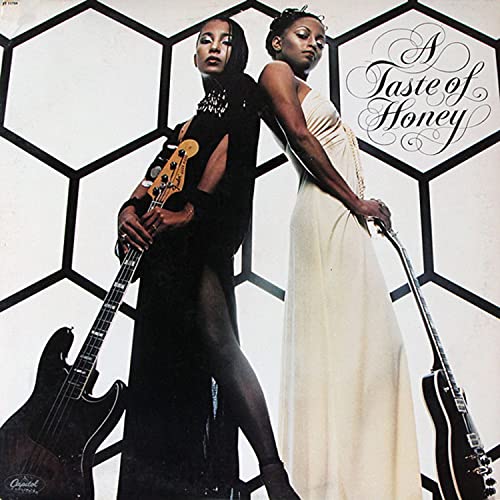 Album cover featuring two Black women with guitars, geometric background.