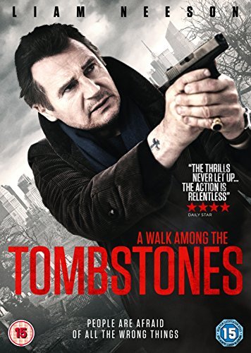Liam Neeson holds a gun on the cover of the DVD "A Walk Among The Tombstones".