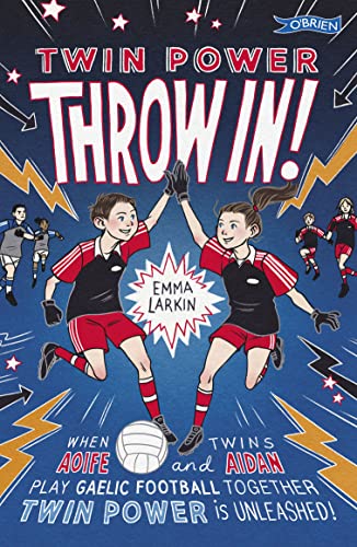 Book cover: two young girls in sports uniforms high-five, with a soccer ball.