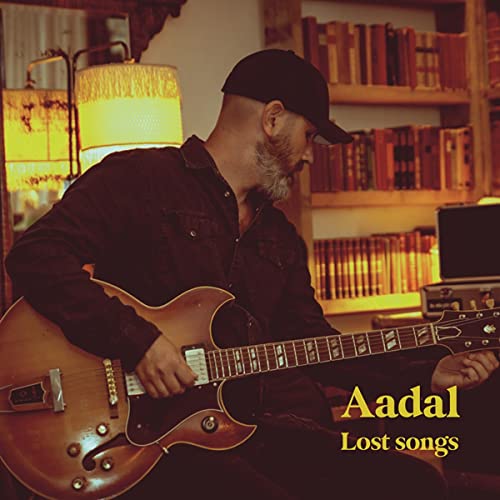 Man playing a guitar, album cover for Aadal’s “Lost Songs” vinyl.