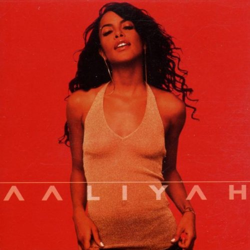 Aaliyah album cover: portrait of the singer in a red dress.