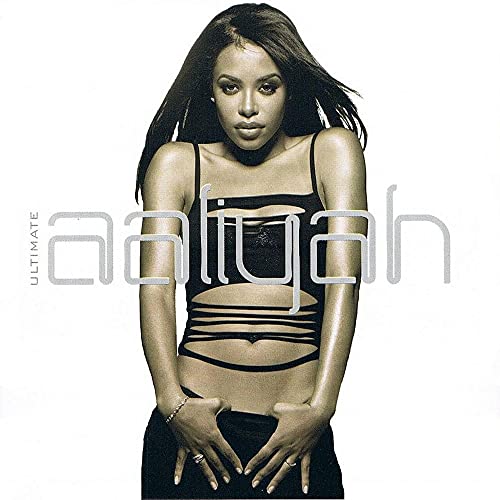 Aaliyah album cover featuring a portrait of the singer in a dark top.