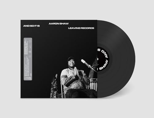 Aaron Shaw's "And So It Is" vinyl record with album cover art.