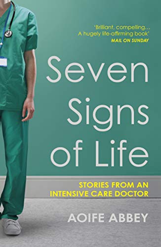 Book cover: "Seven Signs of Life" with a doctor in scrubs.