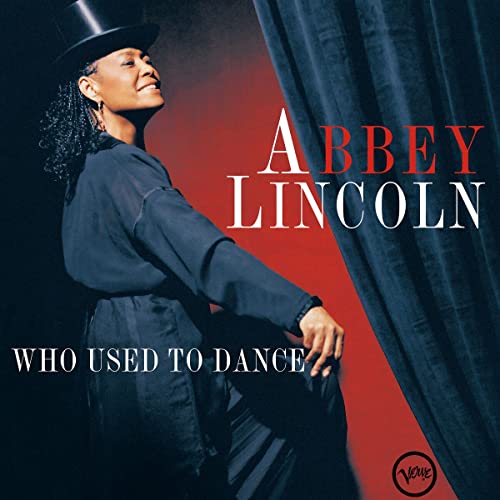 Abbey Lincoln album cover, woman in hat with red and blue backdrop.