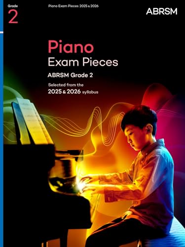 Sheet music book with piano scores, cover likely featuring a musical theme or logo.