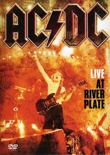 AC/DC “Live At River Plate” DVD cover with guitarist on stage.