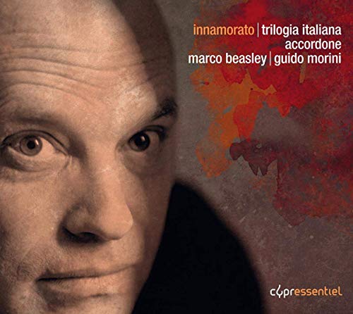 CD cover: close-up portrait of a man with abstract red and orange art.