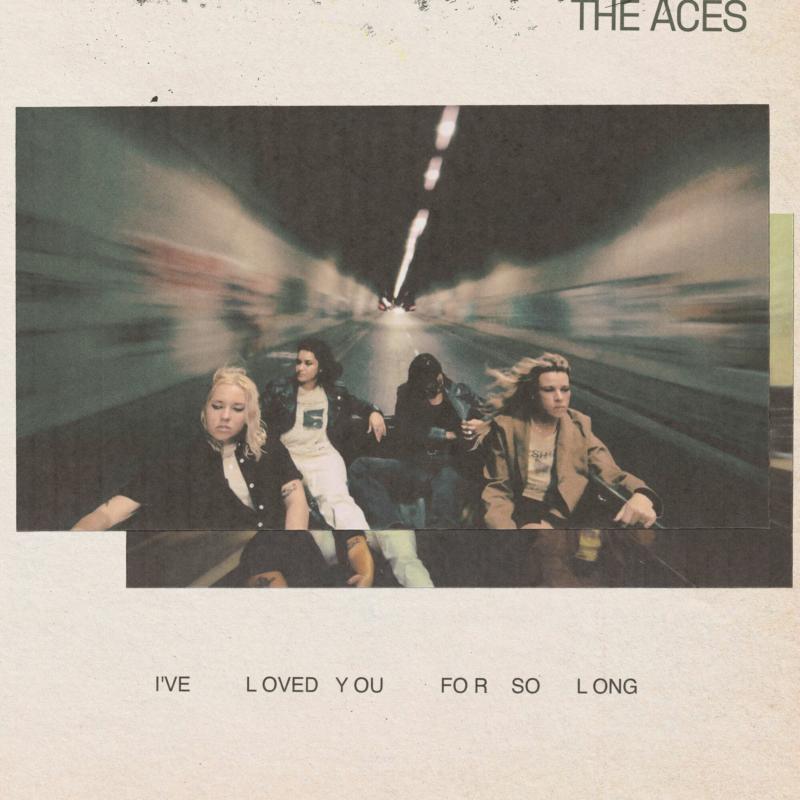 The Aces album cover: four figures seated on a road, blurred motion.