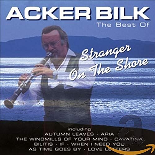 Acker Bilk CD cover with musician playing clarinet by the sea.