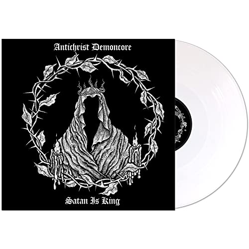 Vinyl record cover with a hooded figure in a crown of thorns and white disc.