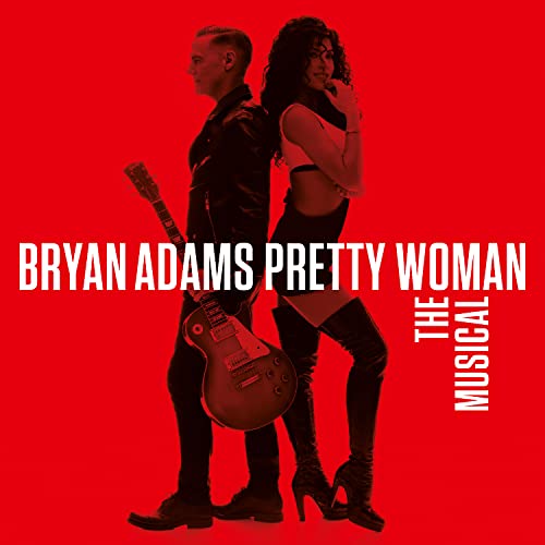Bryan Adams and a woman standing back-to-back against a bright red background.