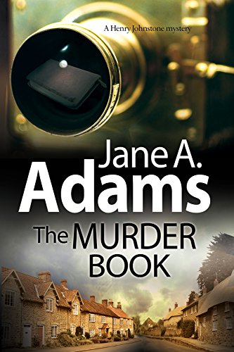 Book cover: “The Murder Book” by Jane A. Adams, with a camera lens.