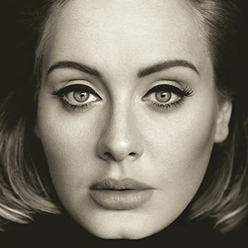 Close-up black and white portrait of Adele, looking directly at the viewer.