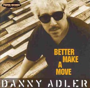Danny Adler album cover: man with sunglasses, wooden background, text.