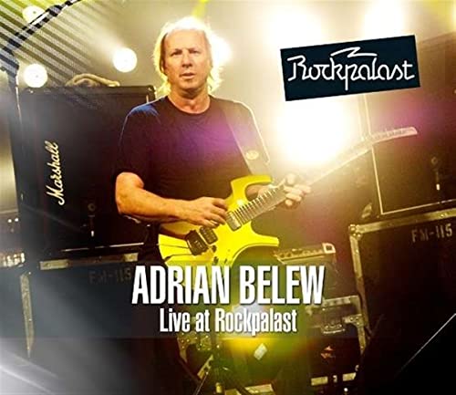 Adrian Belew playing a yellow guitar on stage at Rockpalast.
