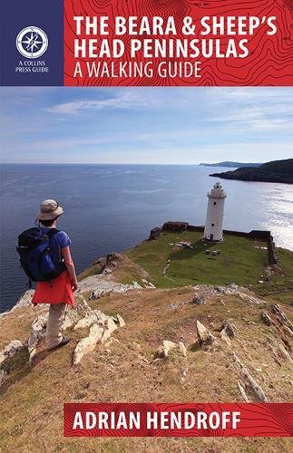 Walking guide cover featuring a lighthouse, coastline, and hiker.