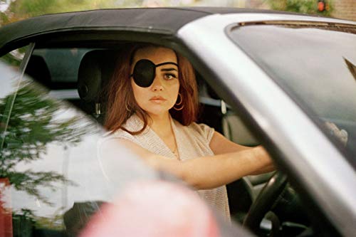 DVD cover with a woman wearing an eye patch, titled "Adult Material" in pink.