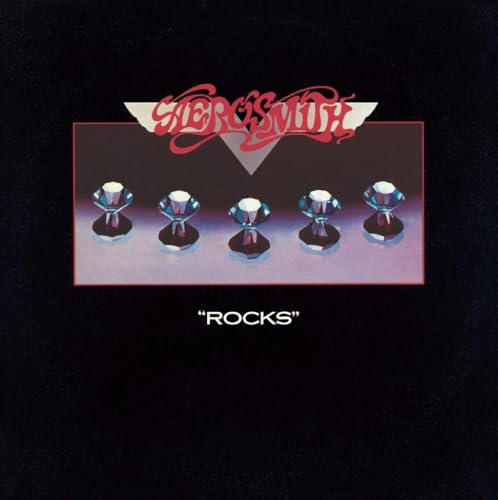 Aerosmith Rocks album cover featuring five diamonds on a dark background with red text.