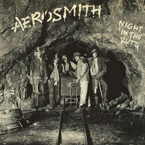 Aerosmith album cover: band posed as miners in a dark cave.