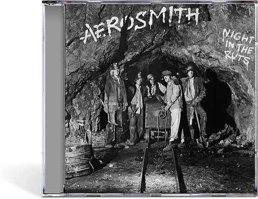 Aerosmith album cover, “Night in the Ruts,” depicting a band in a mine.