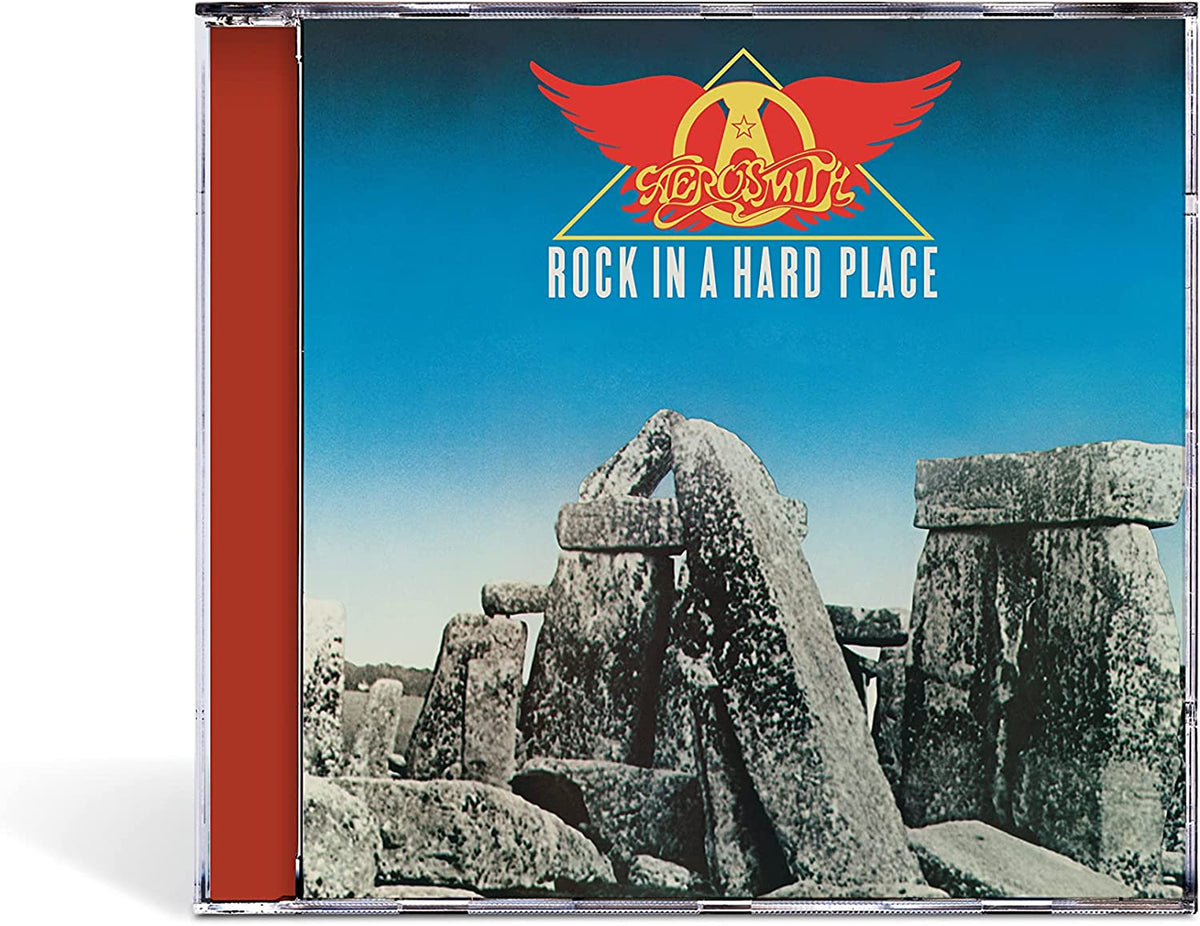 "Aerosmith CD case with red spine, blue cover, and Stonehenge image."