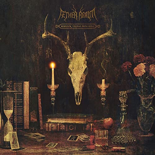 Animal skull with antlers, candles, and books in a dark, still life composition.